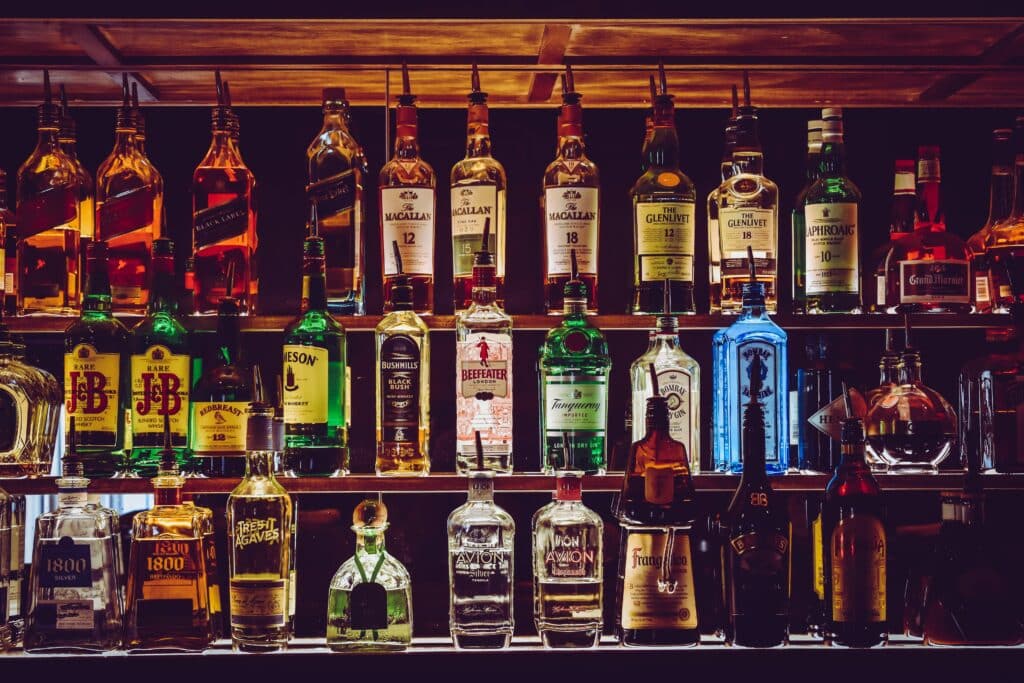 A collection of liquors in a bar.